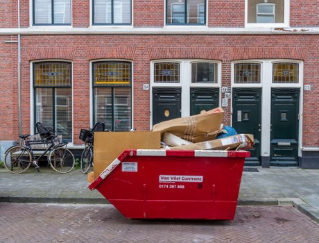 Workers removing bulky furniture from a maisonette